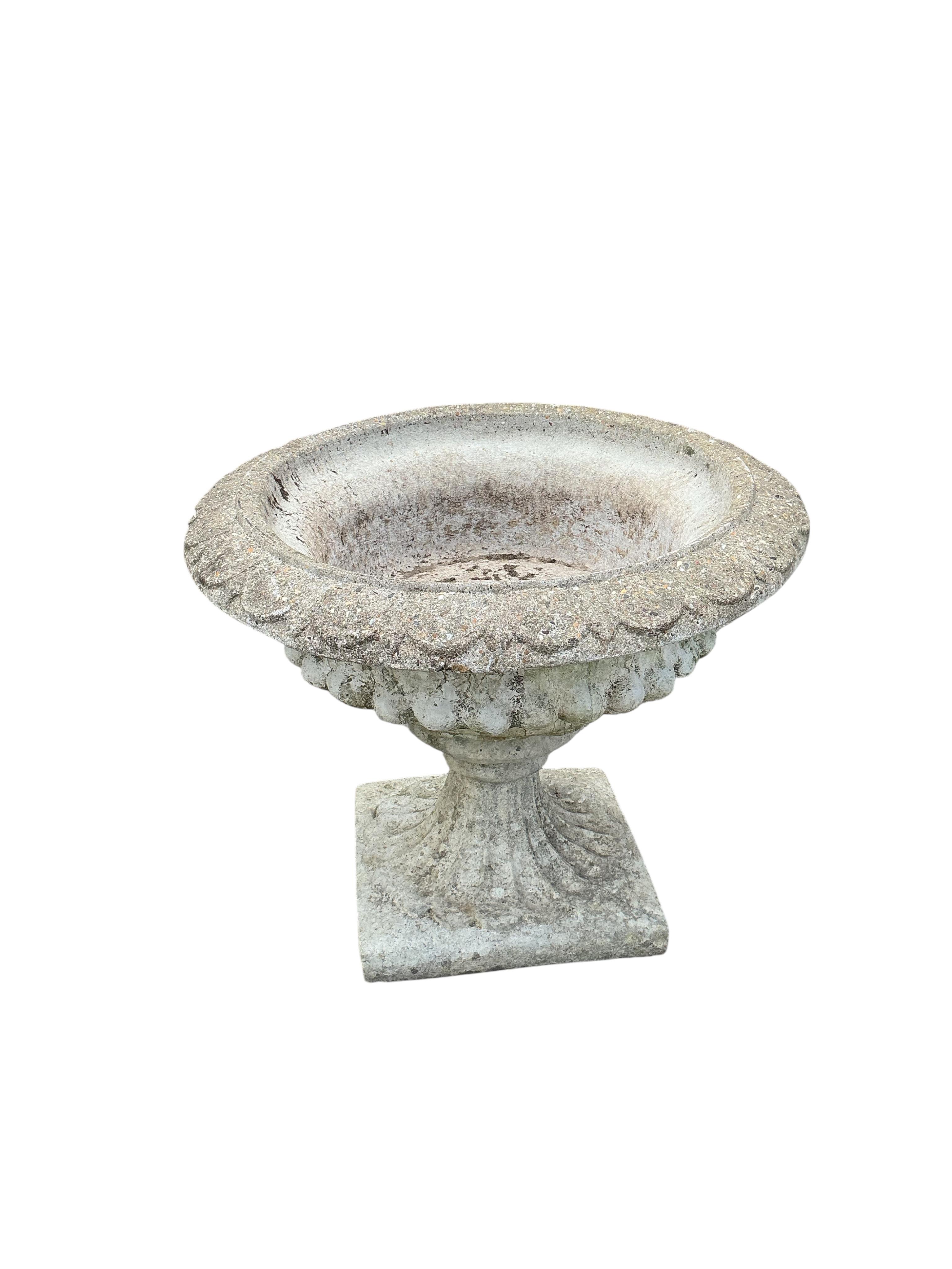 A pair of circular reconstituted stone campana garden urns, diameter 61cm, height 53cm